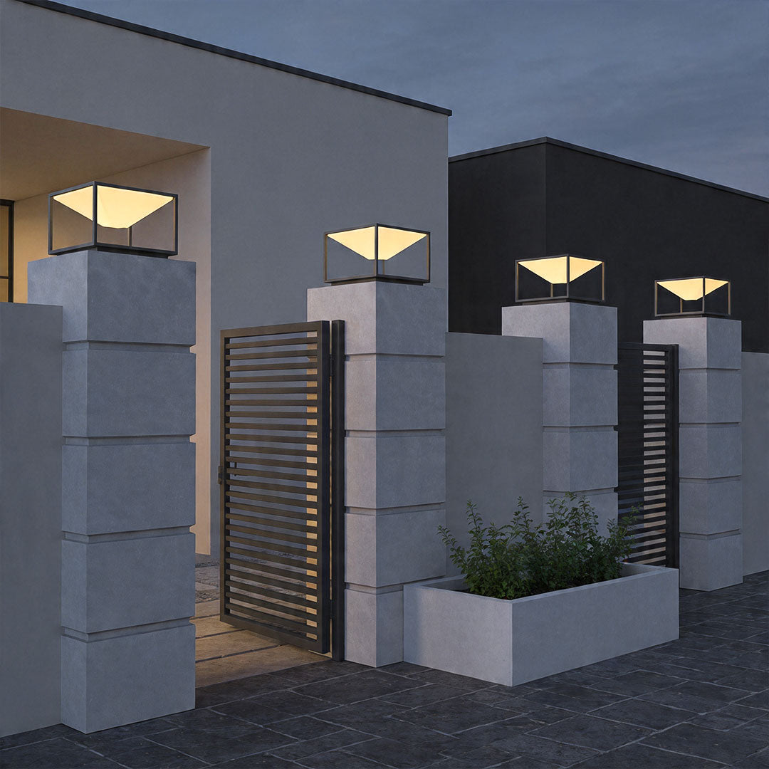 Solar pillar light outdoor mounted on entrance columns creating elegant modern gate lighting.
