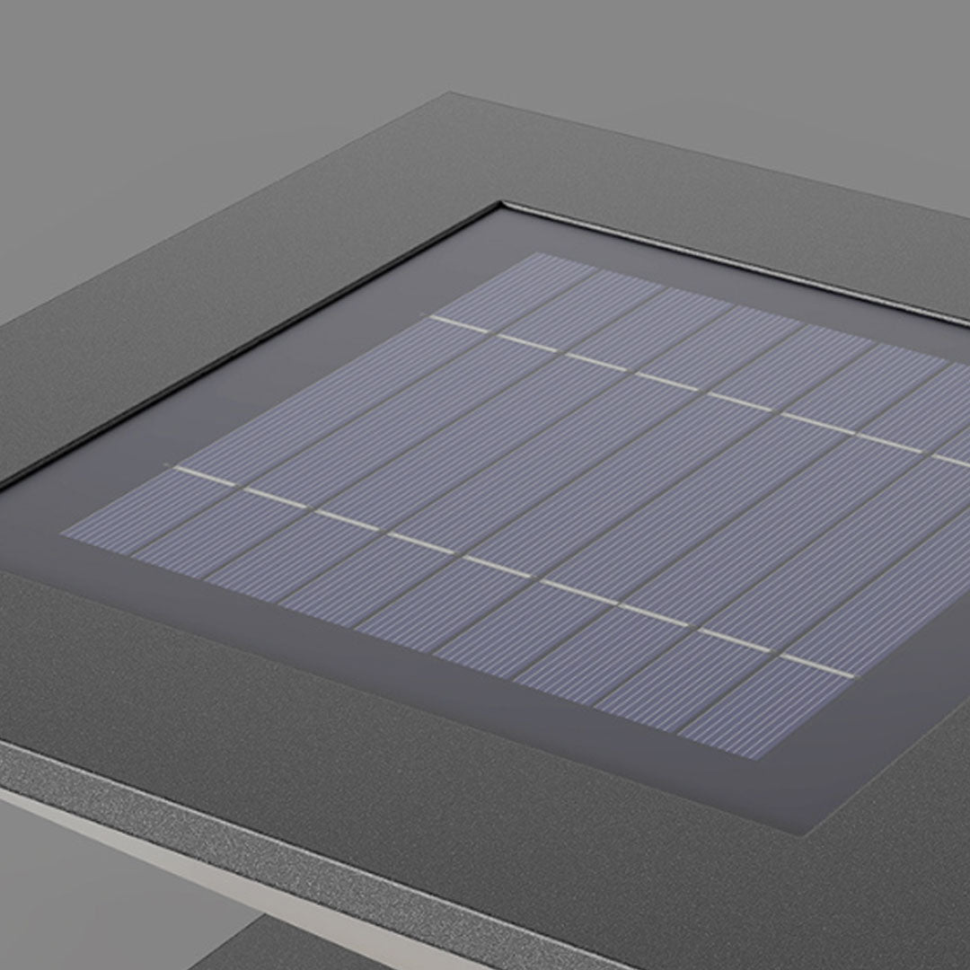 Solar pillar light outdoor close-up featuring illuminated geometric diffuser and modern square design.