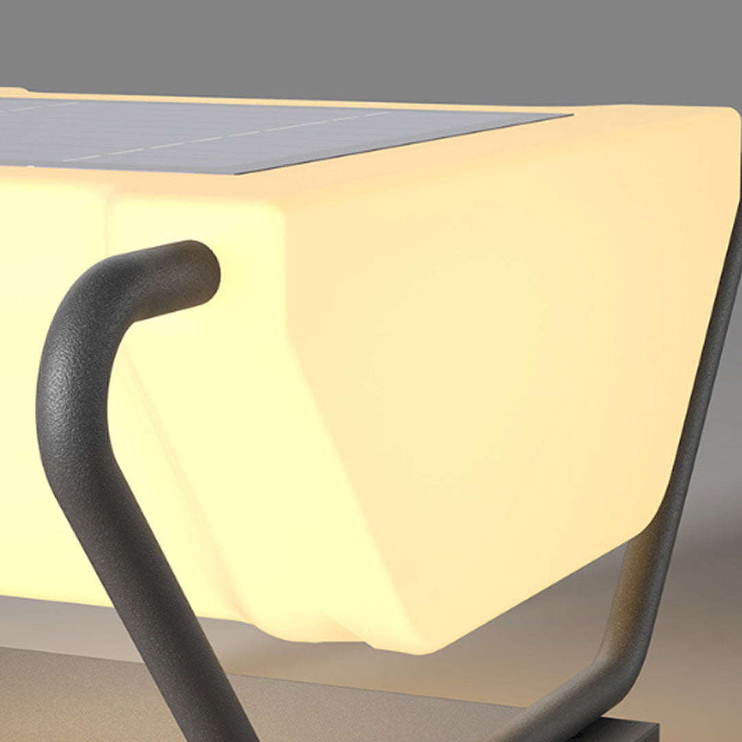 Close-up detail of solar pillar lighting showing curved metal frame and textured base finish.