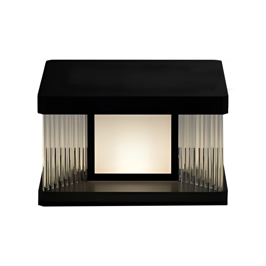 Solar pillar lights with a black finish, installed on a stone base near a fence.