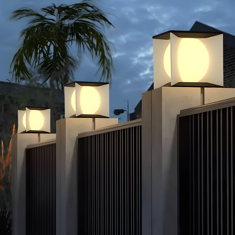 Contemporary solar pillar lights creating ambient pathway lighting in tropical landscape setting