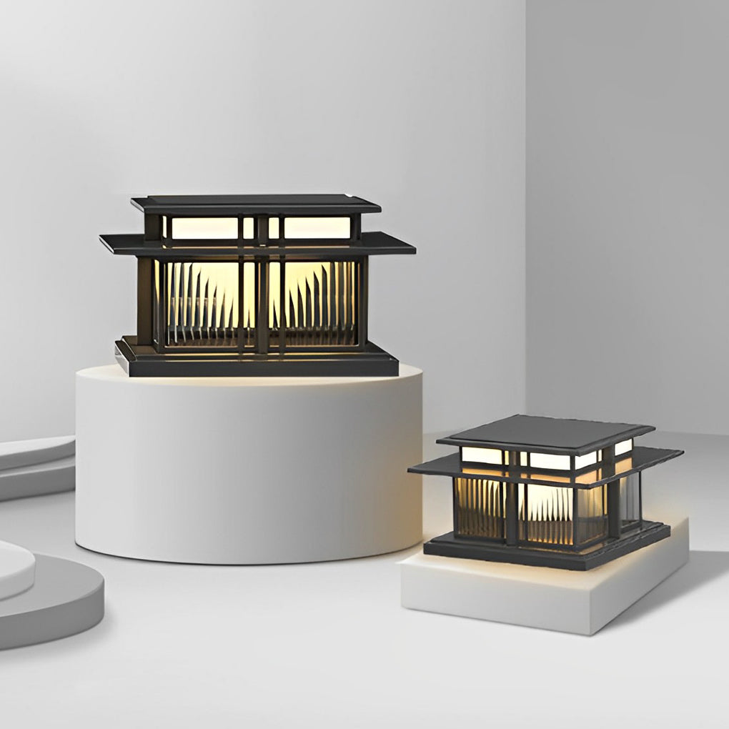 Solar-powered porch pillar lights mounted on a residential driveway column at night.