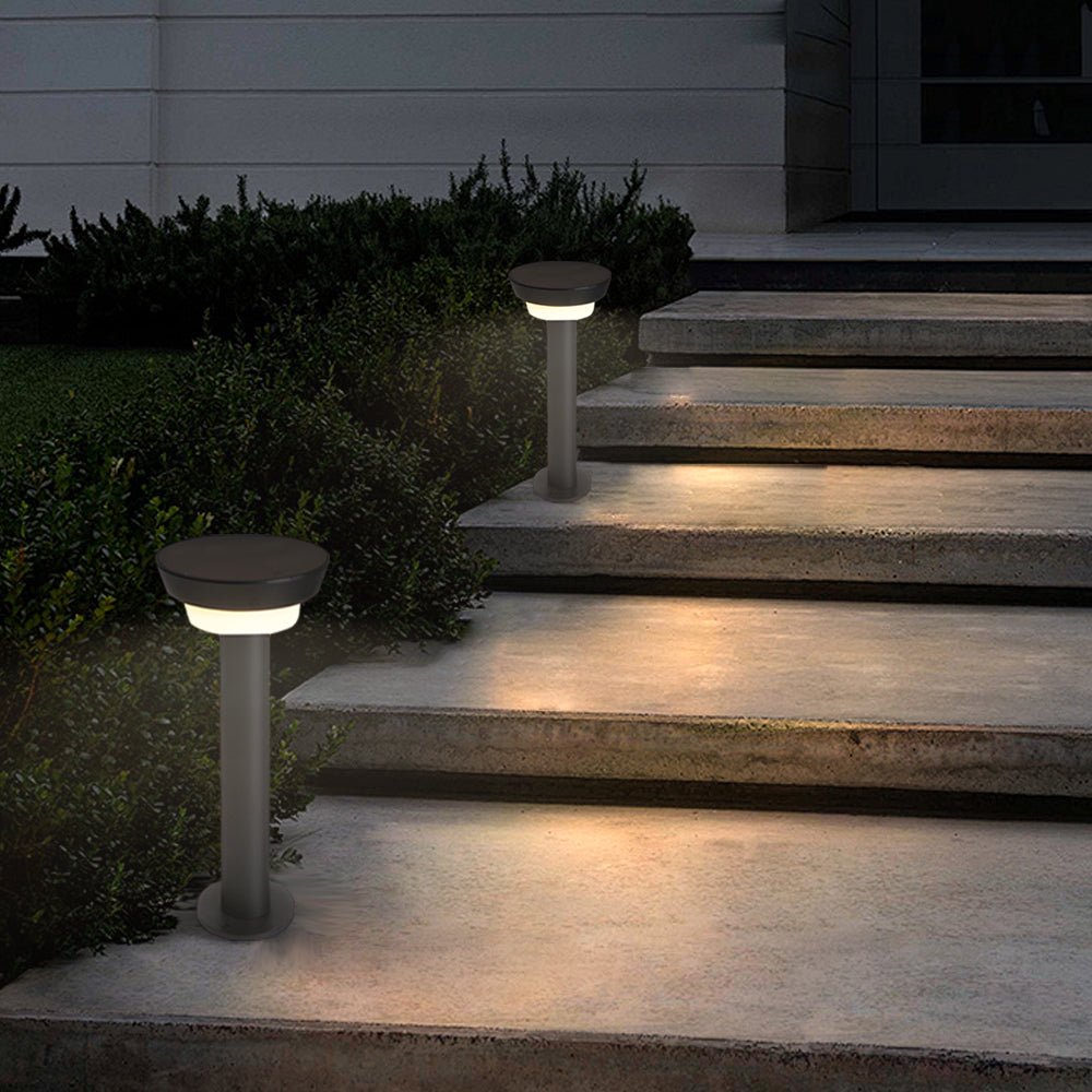 Solar powered garden path lights mounted beside outdoor steps providing safe and subtle nighttime guidance.