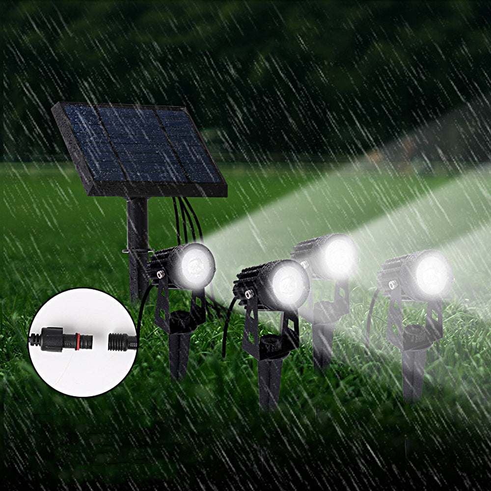 Solar powered landscape spotlight operating in rainy outdoor conditions