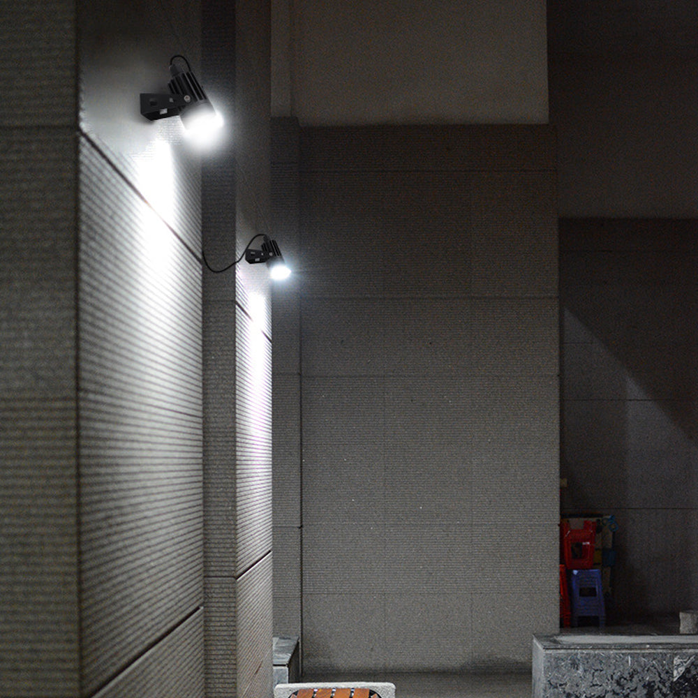 Solar powered landscape spotlight used for outdoor wall lighting