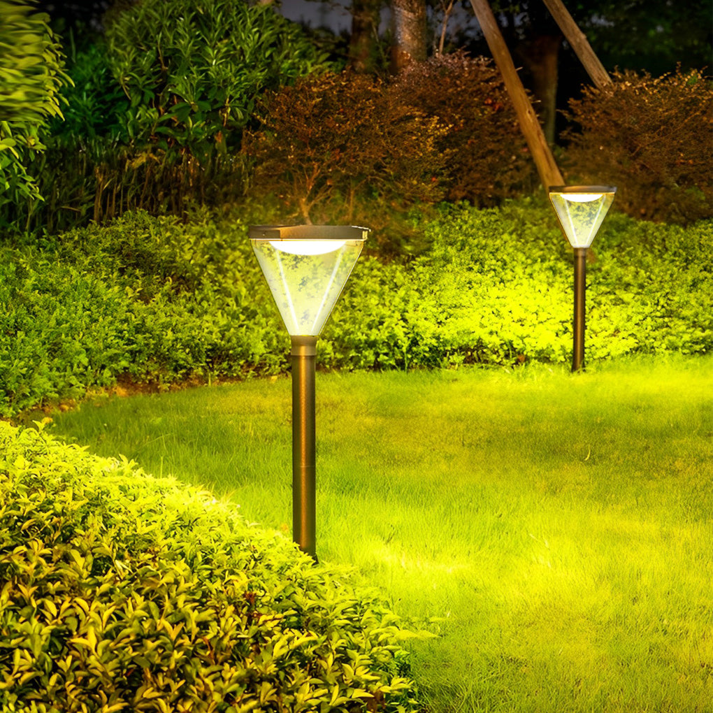 Solar powered lawn lights installed in a lush green garden, creating a warm ambiance.