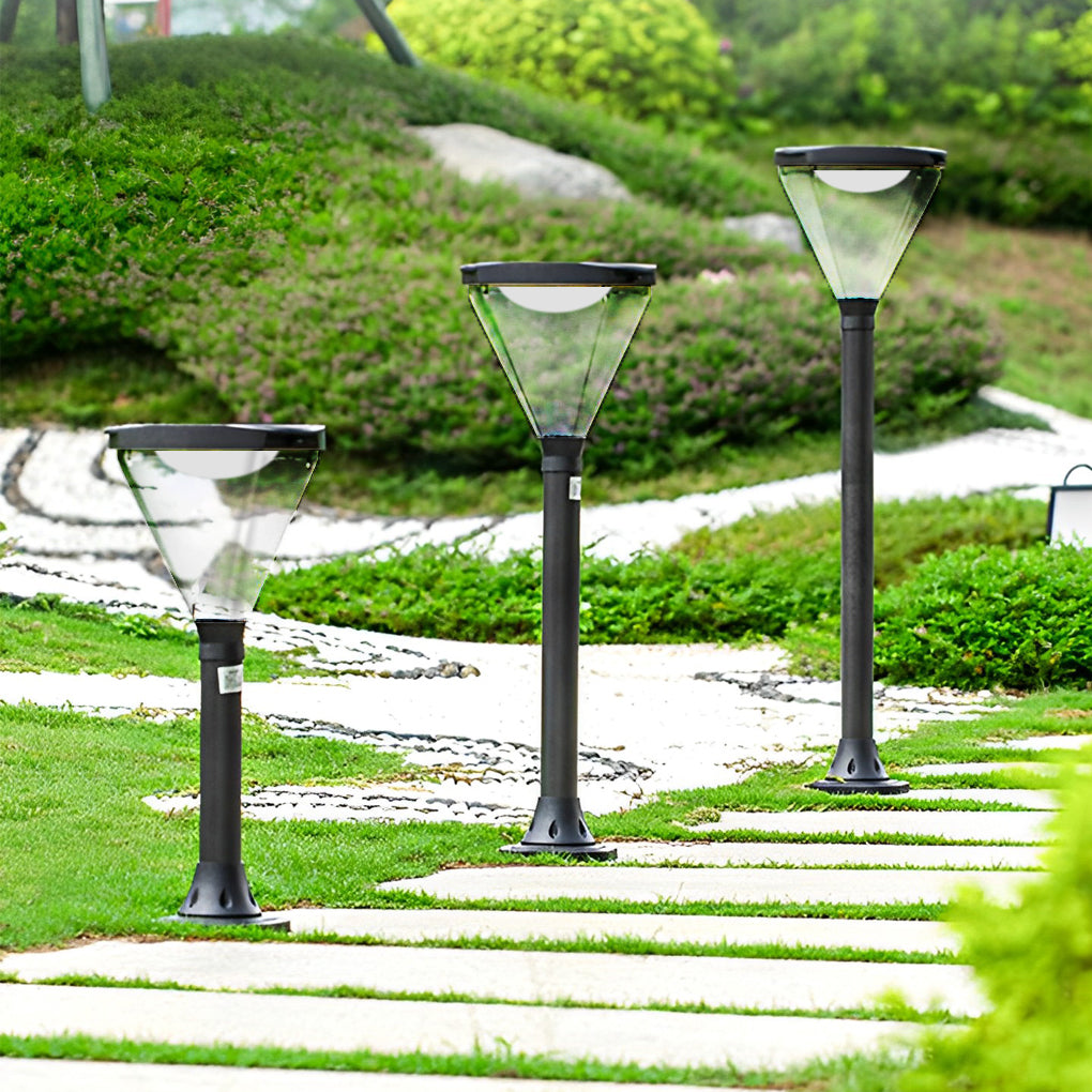 Solar powered lawn lights lining a stone pathway, providing safe and elegant lighting.