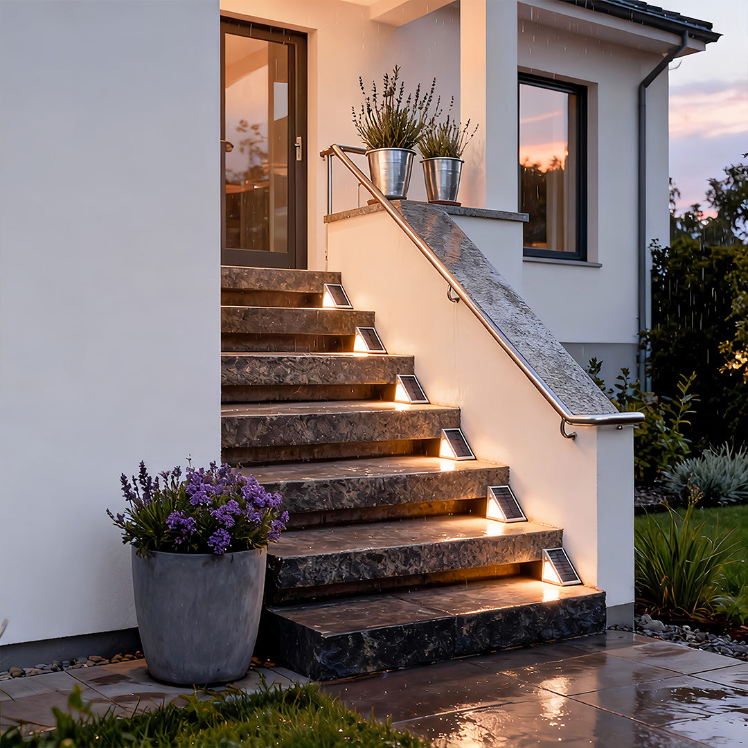 Solar powered lights for steps illuminating a modern outdoor staircase, creating warm and safe pathway lighting at night.