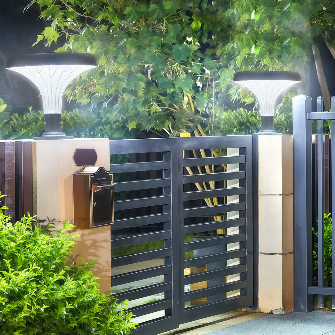 Solar-powered pillar light placed along a driveway, offering illumination for the outdoors.