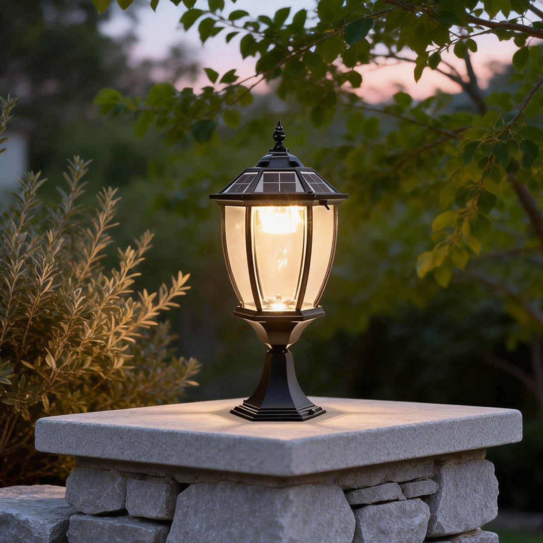 Solar powered pillar lights illuminating a garden pathway with warm, eco-friendly glow.