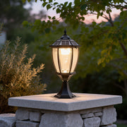 Solar powered pillar lights illuminating a garden pathway with warm, eco-friendly glow.