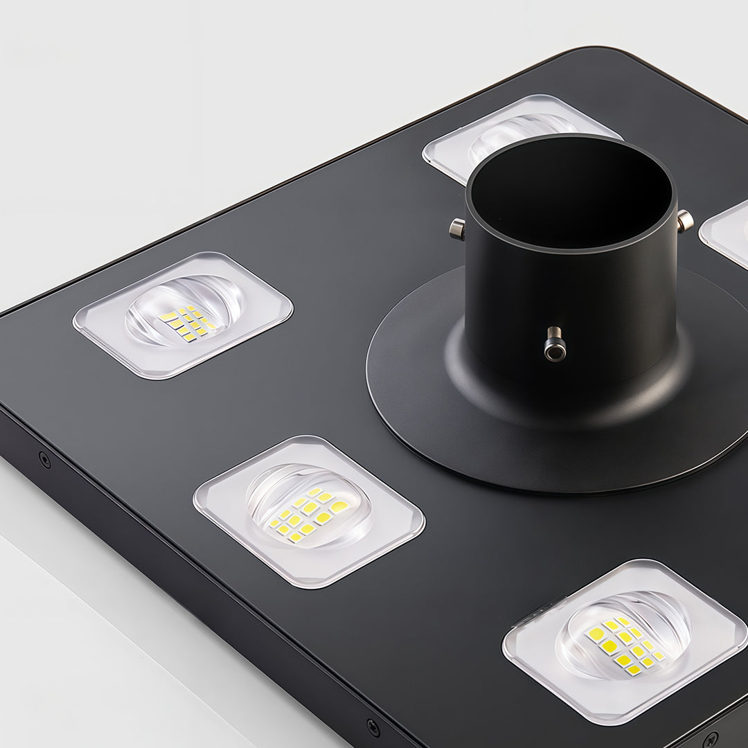 Solar-powered streetlight illuminating a landscaped area, perfect for eco-conscious lighting.