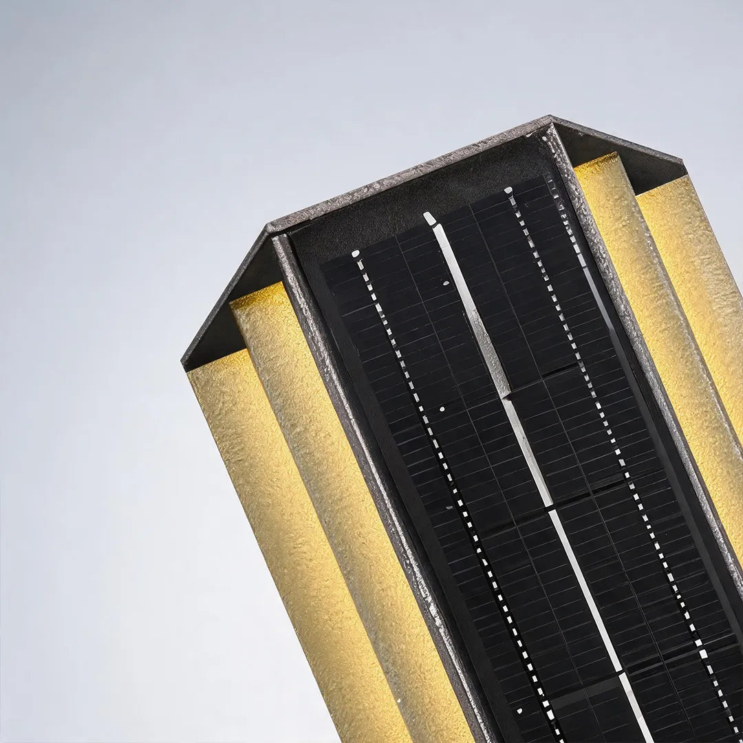 Solar wall light with integrated solar panel and black metal housing