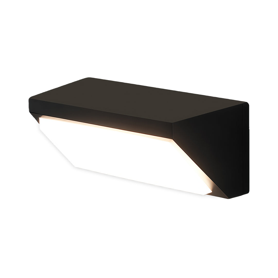 Black solar outdoor wall sconce installed on a wooden exterior, casting a warm light in a modern garden setting.