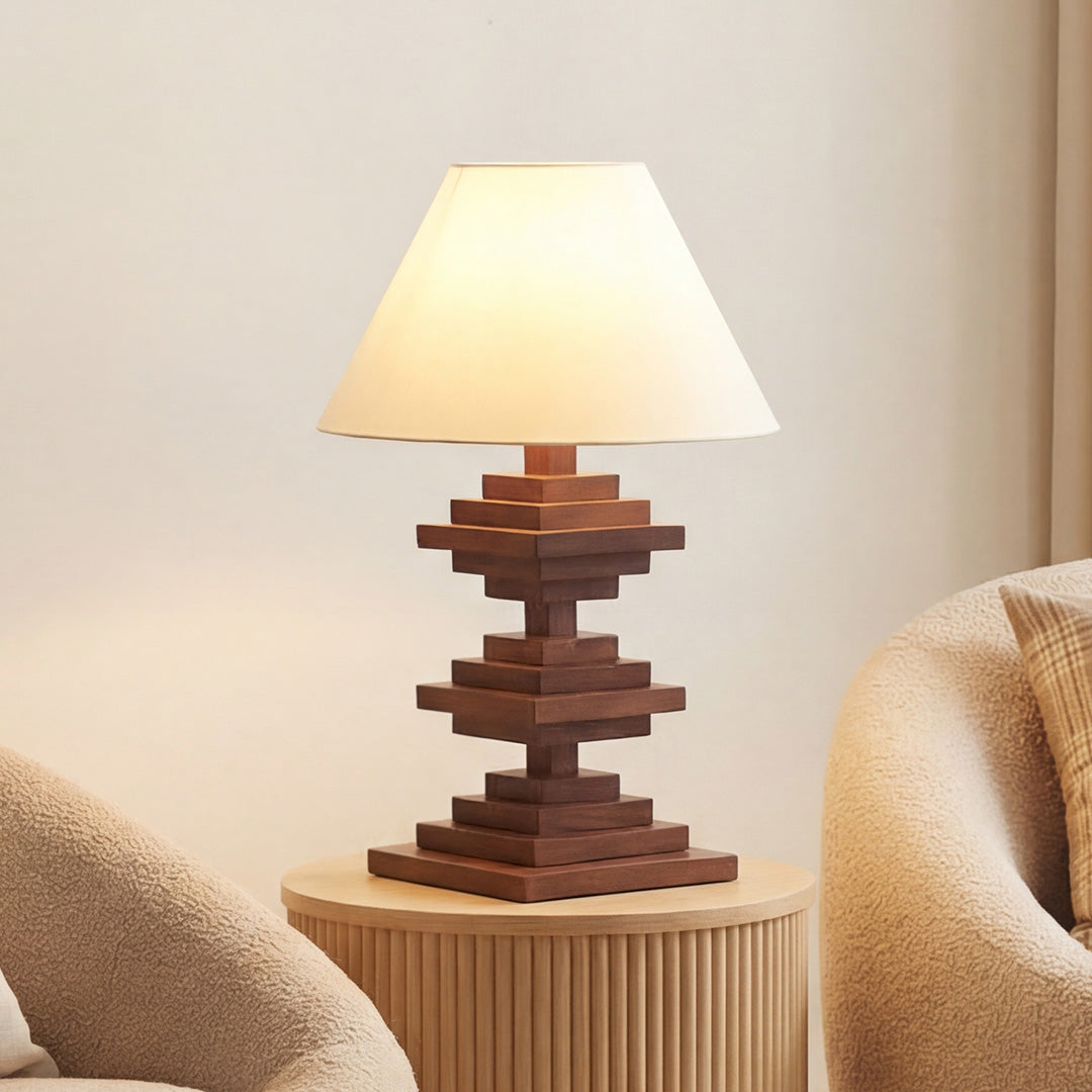 Handcrafted solid wood table lamps with a stacked geometric wood base and a cream fabric shade.