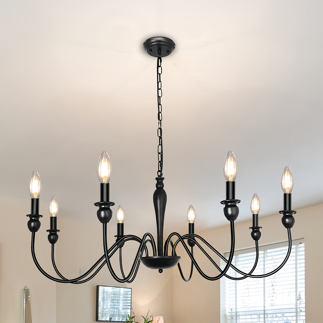 Sophisticated black candle chandelier in formal dining room with traditional decor and window treatments