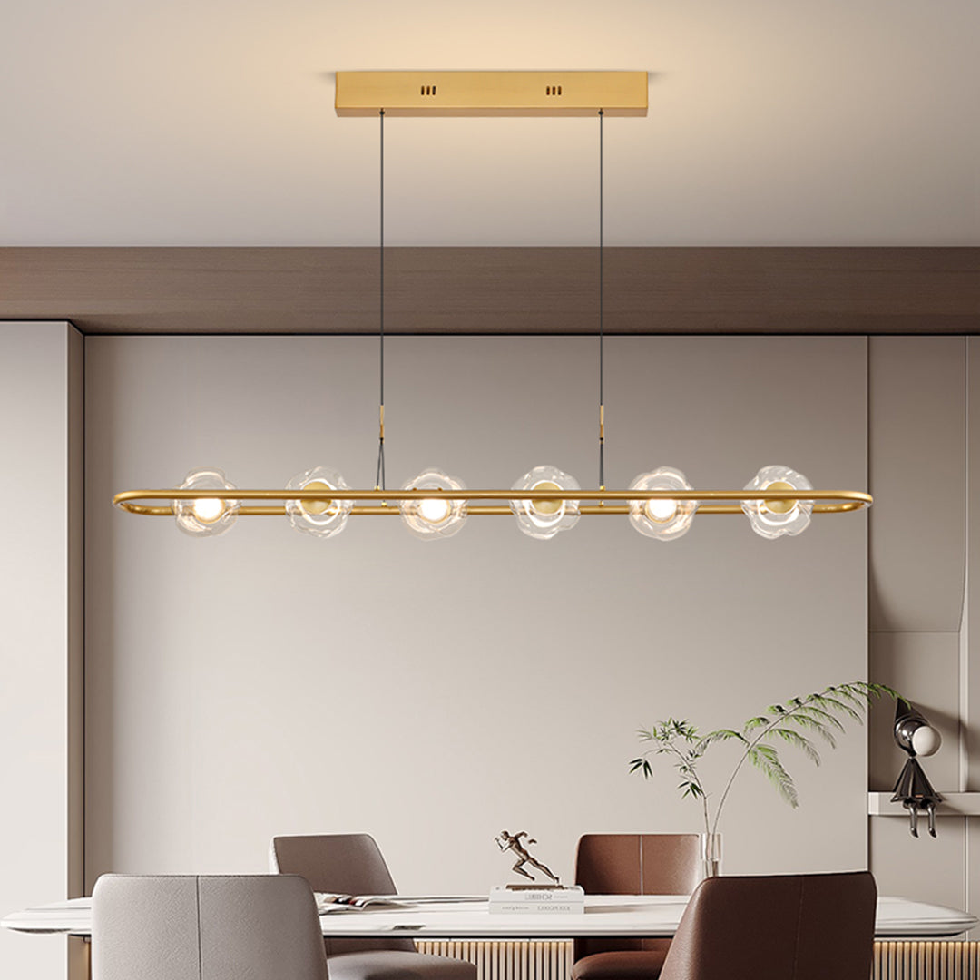Sophisticated rise and fall pendant light featuring brass elements in contemporary dining room