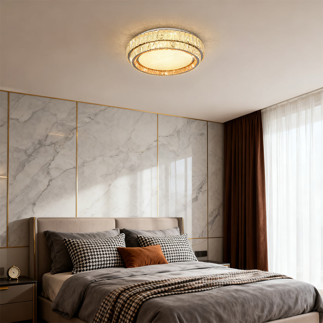 Sophisticated contemporary flush mount lighting featuring glass shade chandelier influence in elegant marble-accented bedroom suite.