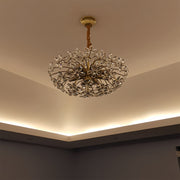 Sophisticated crystal flower chandelier mounted in elegant room with ambient lighting