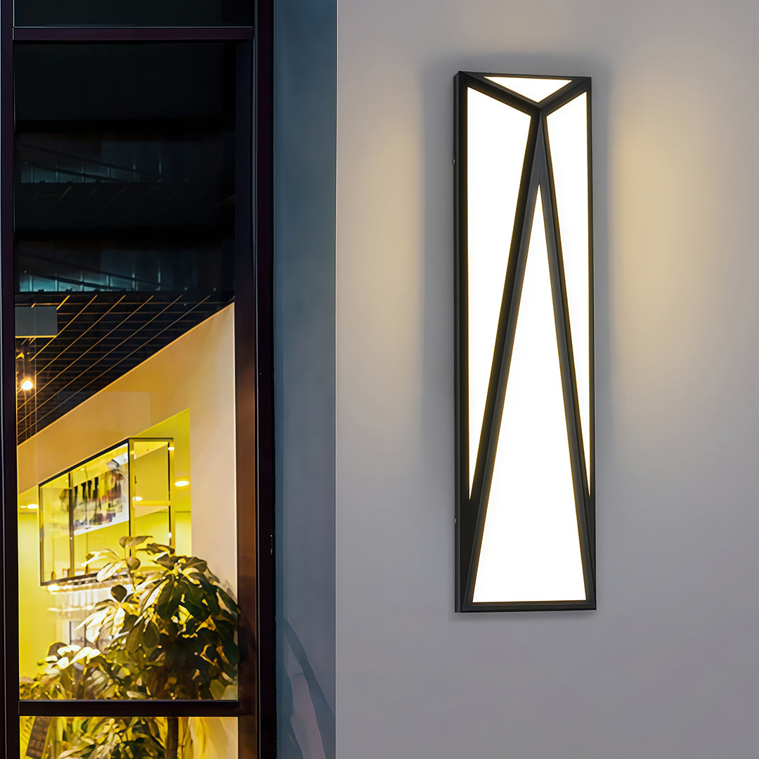 Sophisticated exterior wall light black with glass shade chandelier influence illuminating modern entrance with accent lighting.
