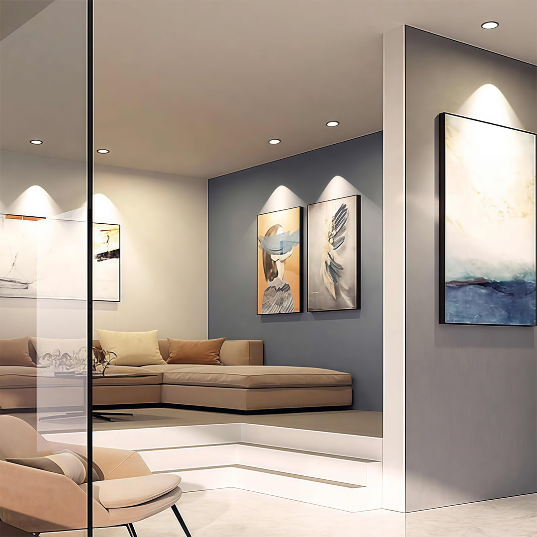 Sophisticated flush mount spotlights featuring glass shade chandelier design creating warm accent lighting in contemporary interior.