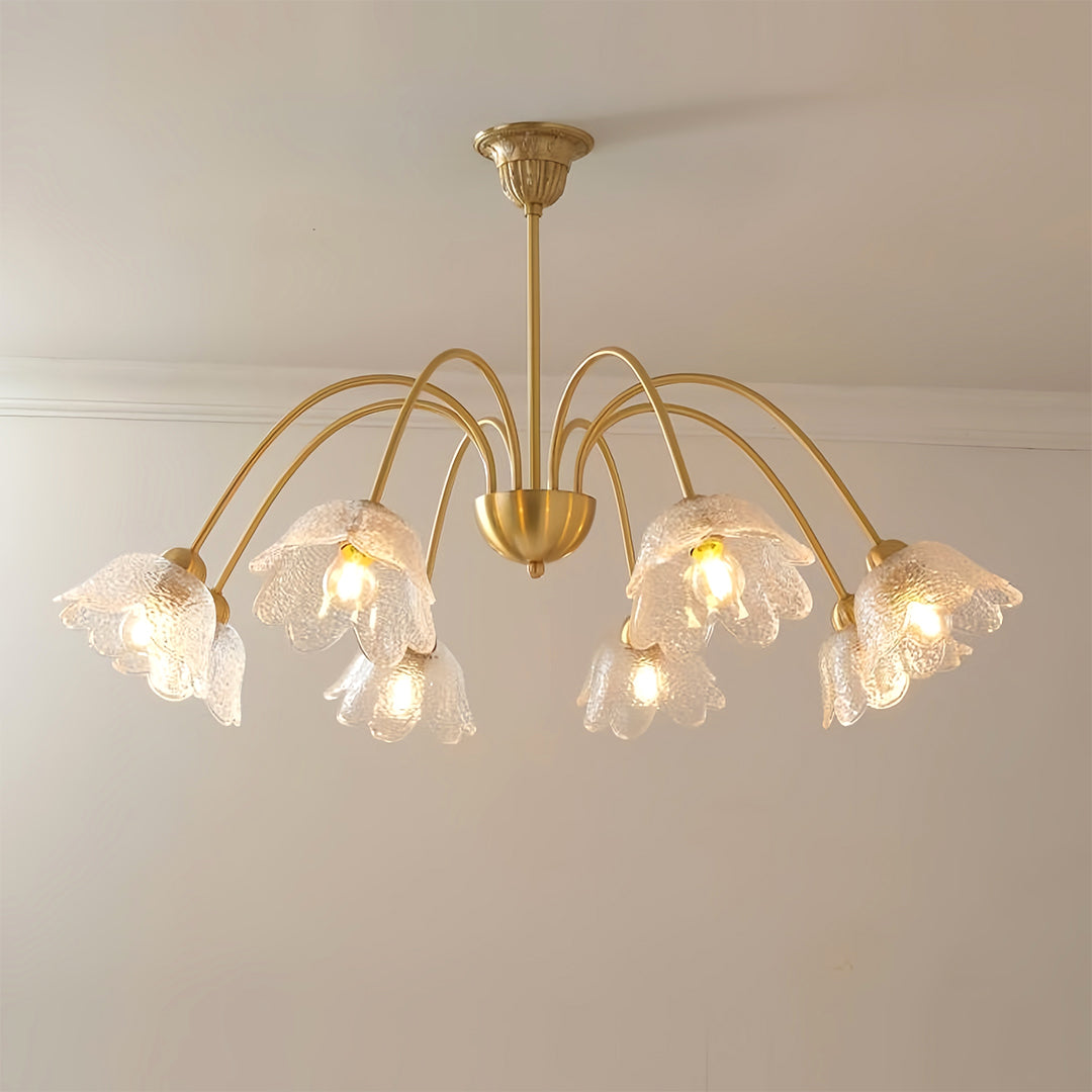 Sophisticated glass shades chandelier installed in modern interior with elegant brass and glass combination