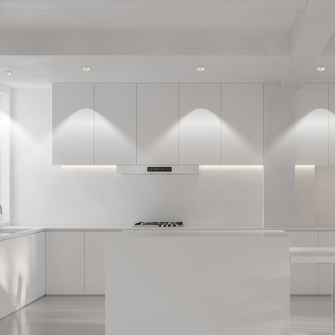 Sophisticated interior spotlights with glass shade chandelier styling creating dramatic wall-washing effect in contemporary room.