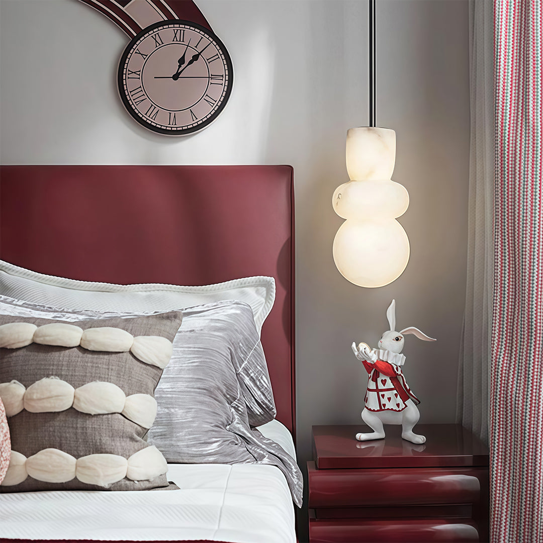 Sophisticated minimalist pendant light with glass shade chandelier influence illuminating modern gray bedroom with warm ambient light.