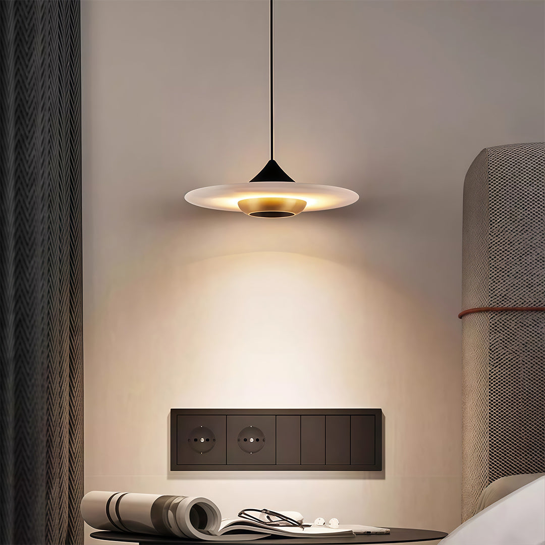 Sophisticated modern LED pendant lights featuring glass shade chandelier design providing focused task lighting over wall-mounted nightstand.