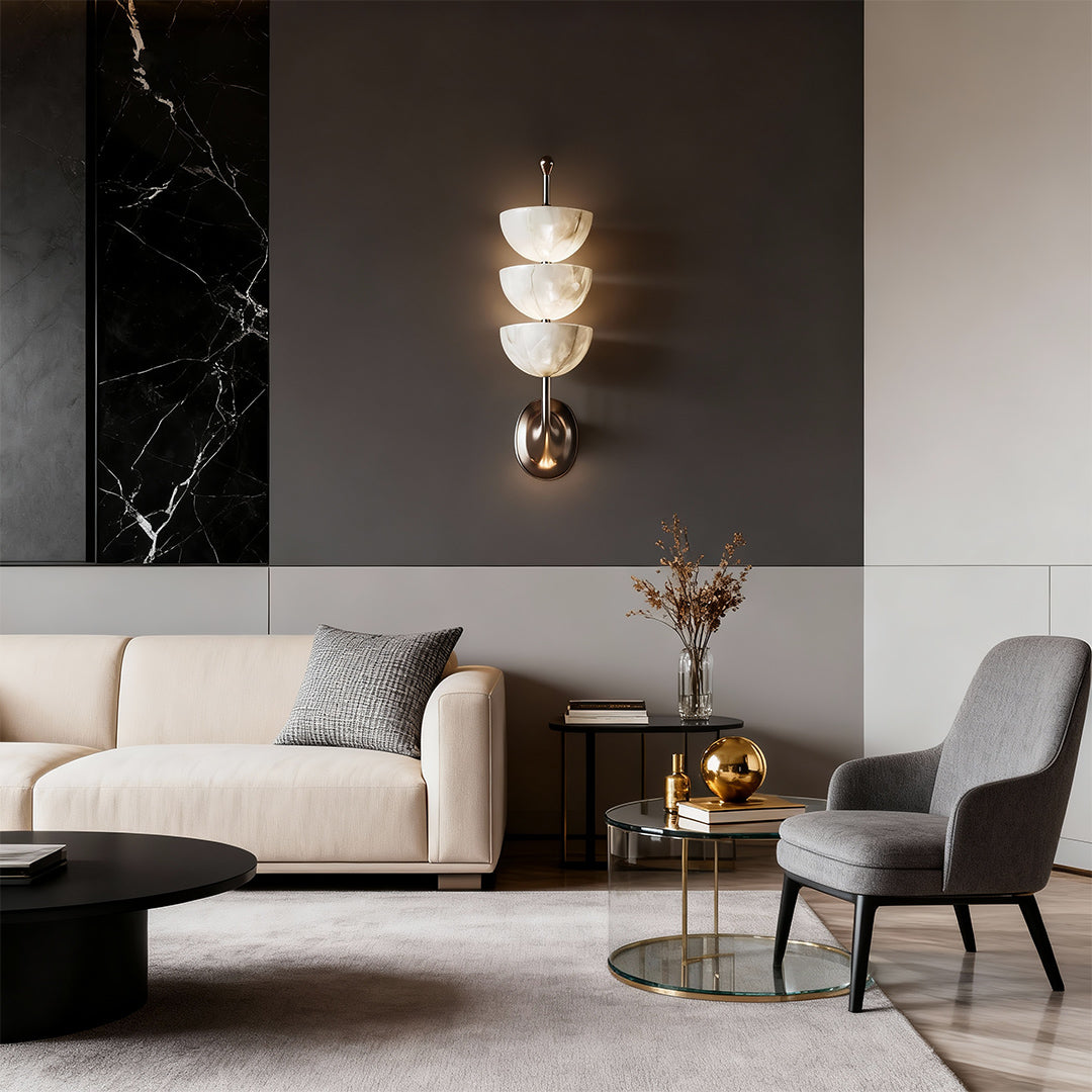 Sophisticated modern LED wall lights with glass shade chandelier design providing ambient accent lighting in contemporary living room.