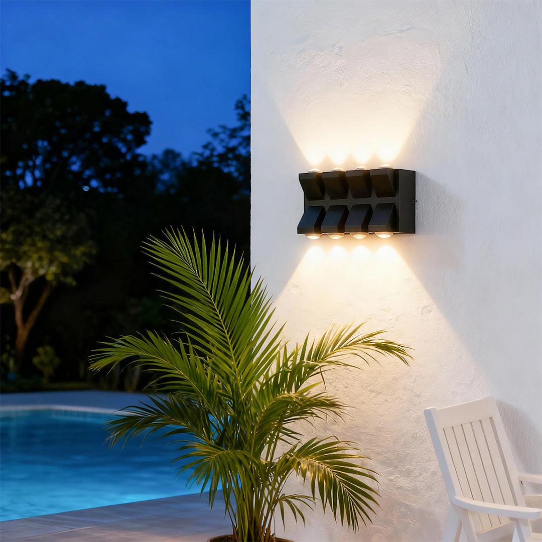 Sophisticated outdoor wall lights black featuring glass shade chandelier influence providing ambient poolside lighting at twilight.