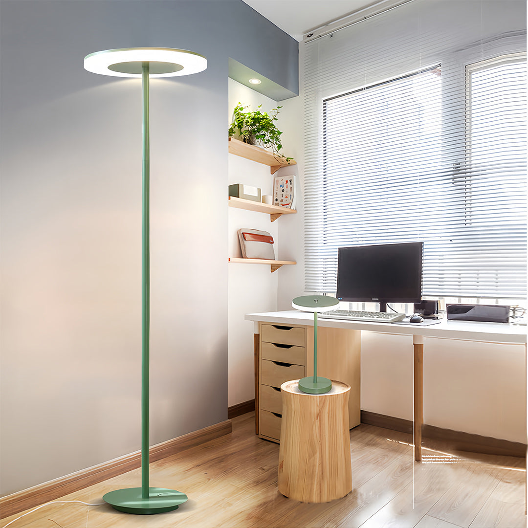 Sophisticated colored floor lamp in teal creating ambient lighting in stylish modern living room