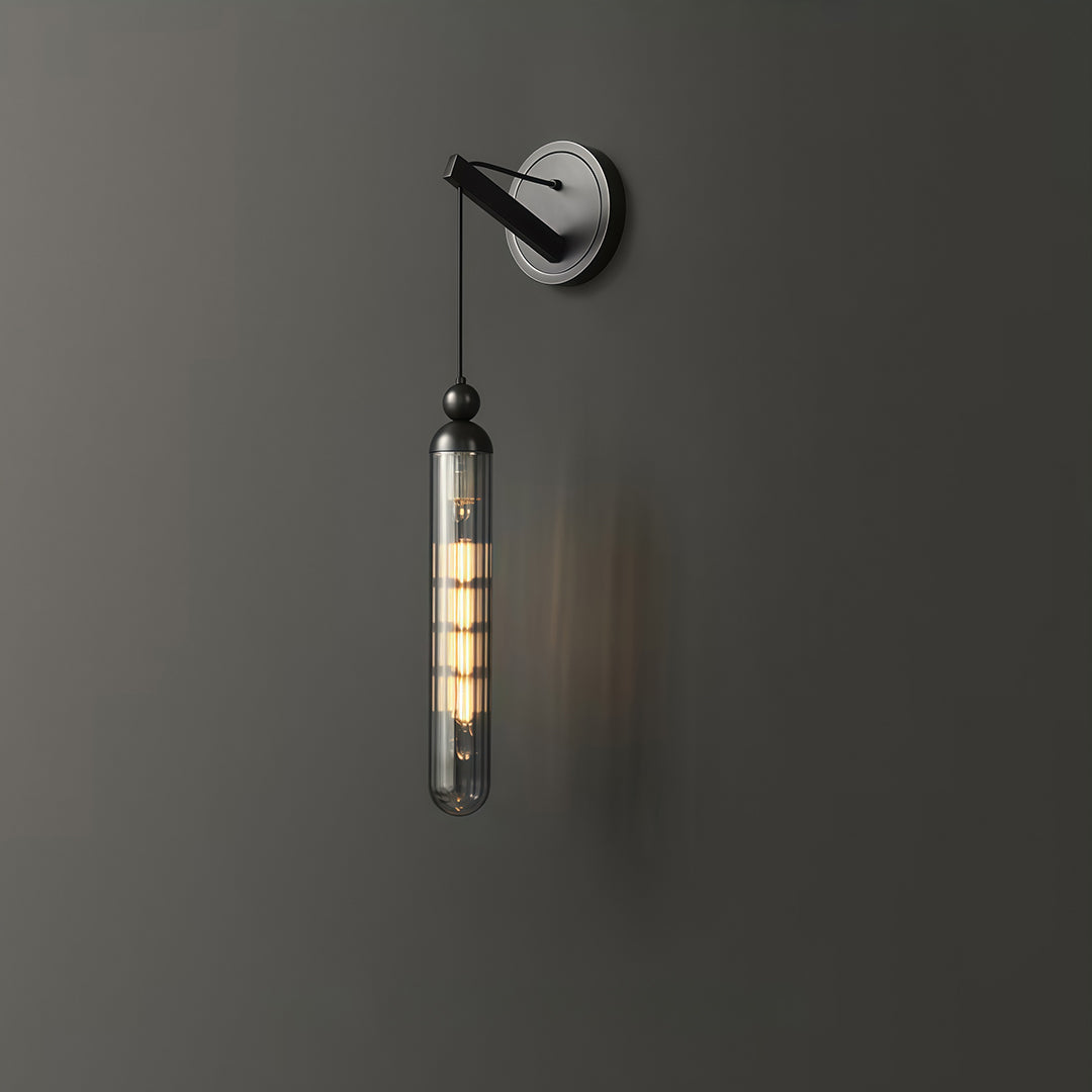 Sophisticated wall mount pendant light with glass shade chandelier design in black providing dramatic lighting on dark wall.
