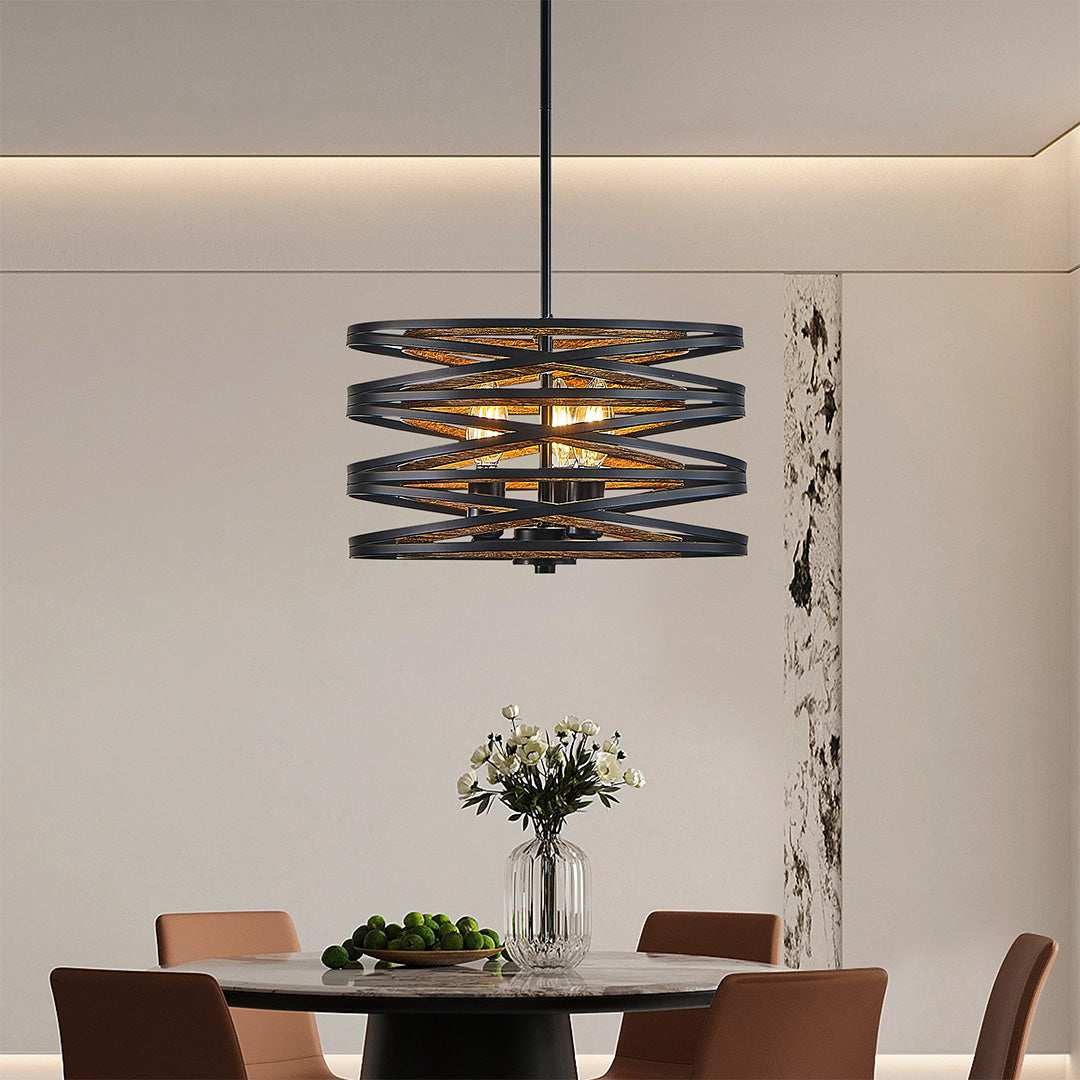 Black drum pendant light in a spacious dining area, complementing the room's contemporary decor.