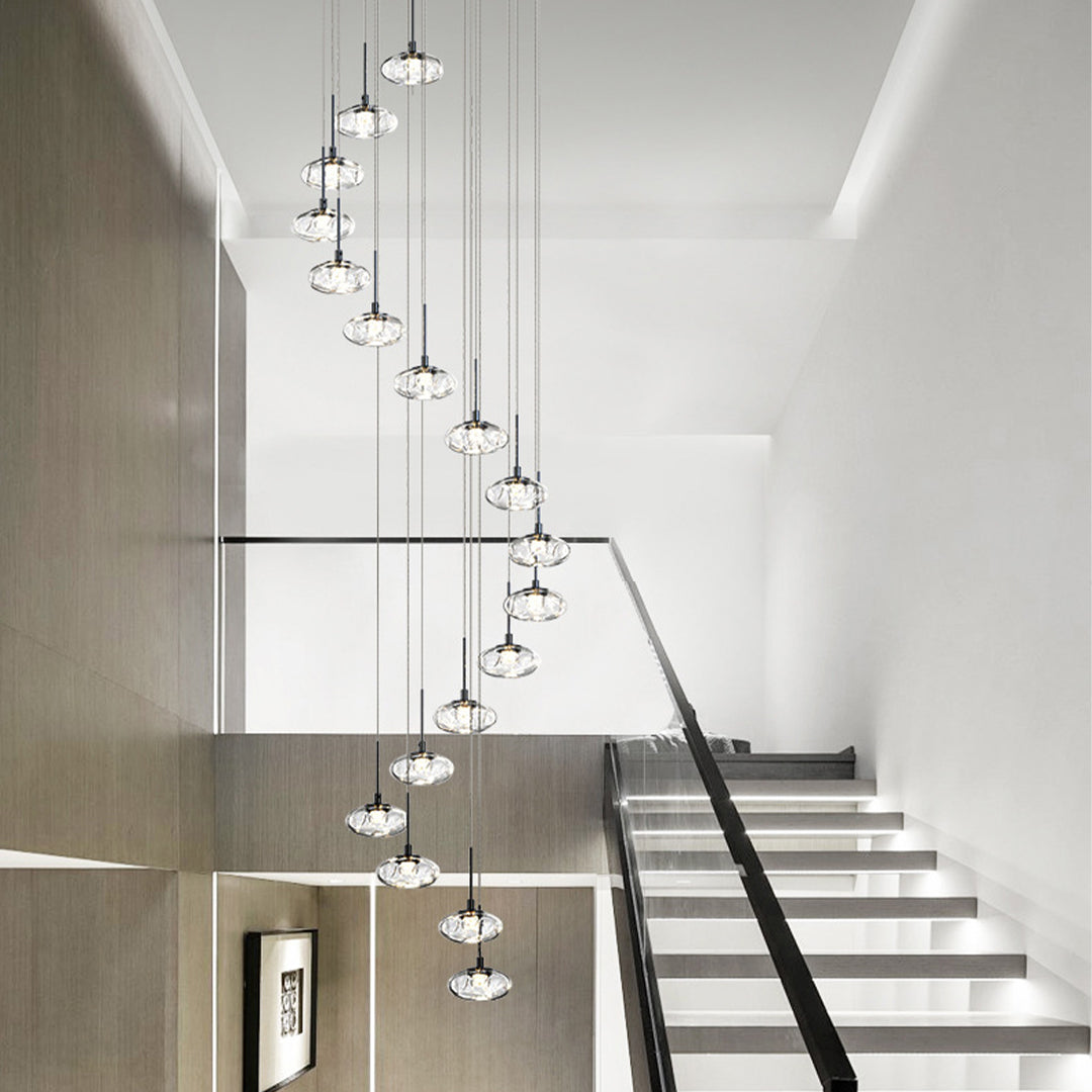 Contemporary chandelier for tall ceilings enhancing spacious entryway with cascading crystal glass pendant design