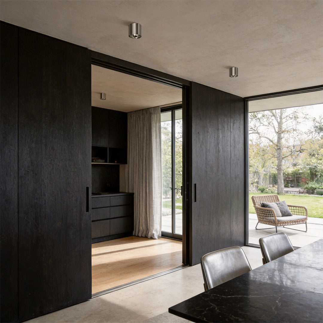 Spacious living room with silver ceiling spotlights offering clean, modern illumination.