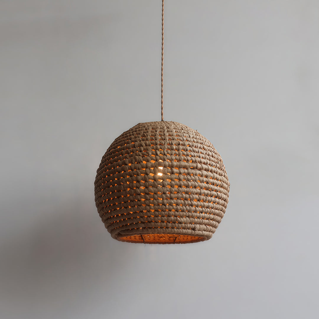 Japanese paper pendant light suspended in a spacious room, bringing warmth and beauty to the interior.