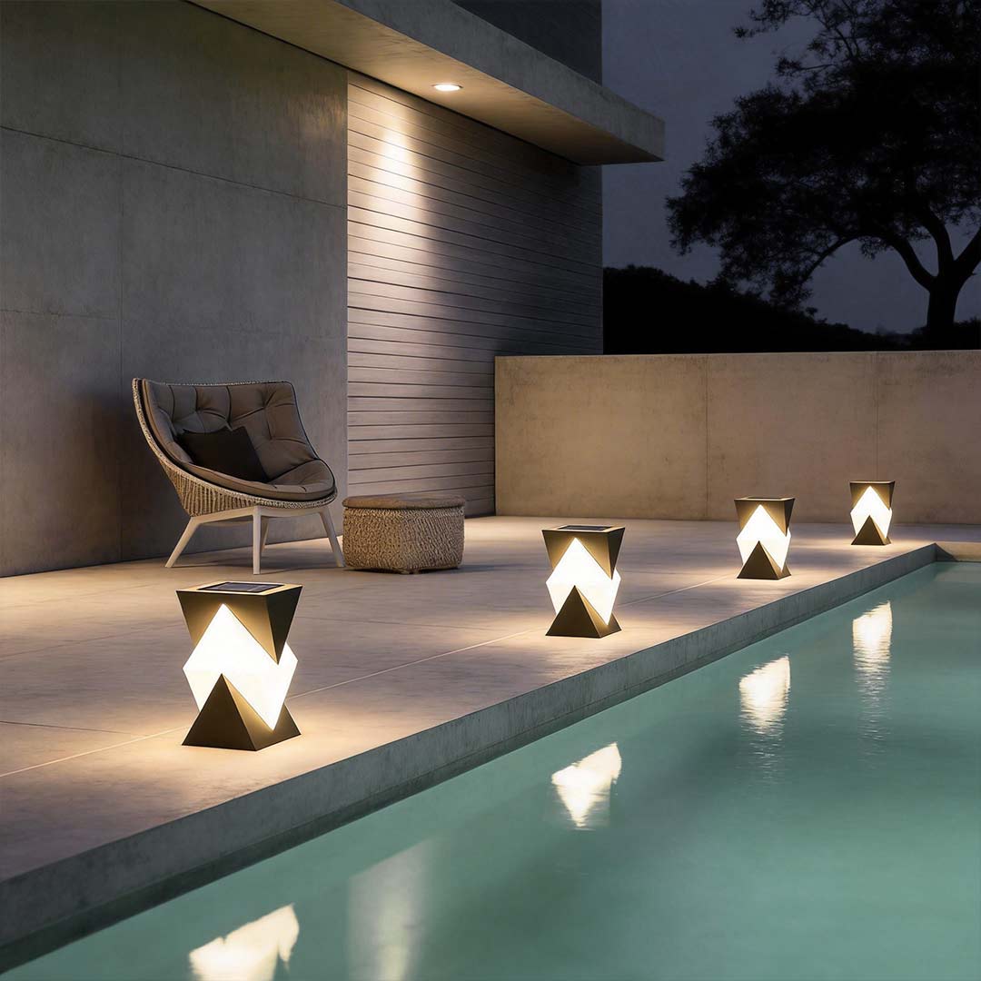 Special shaped pillar light with a close-up of its triangular design by a poolside.