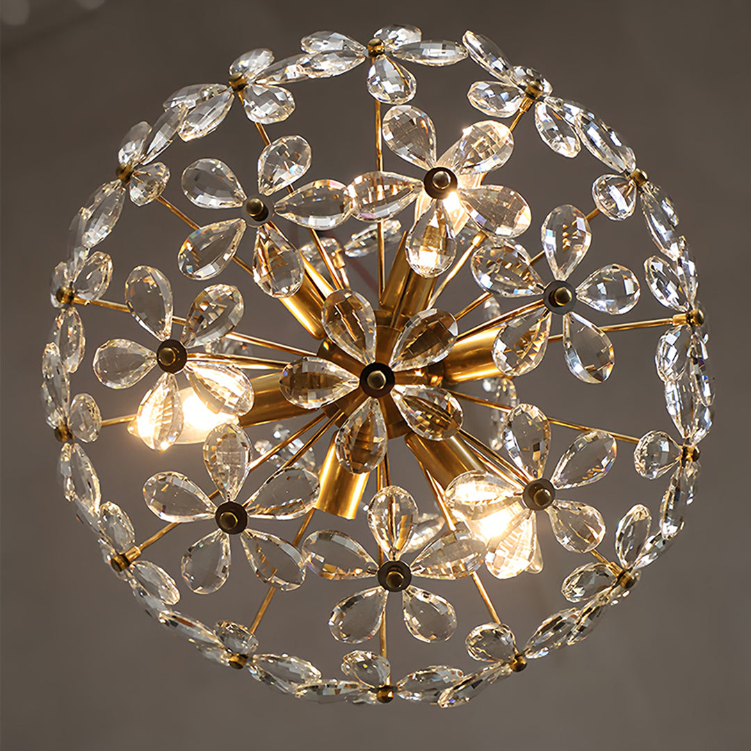 Spherical crystal flower chandelier with radial design creating stunning light dispersion