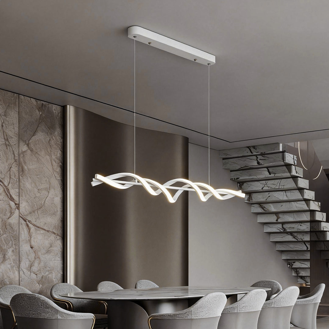 A modern spiral pendant linear hanging chandelier adds elegance to a contemporary dining area, creating a warm and inviting ambiance.