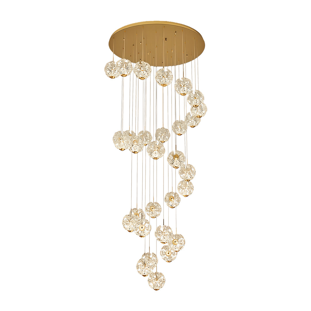 Three-layer spiral staircase crystal chandelier with cascading round crystal shades.