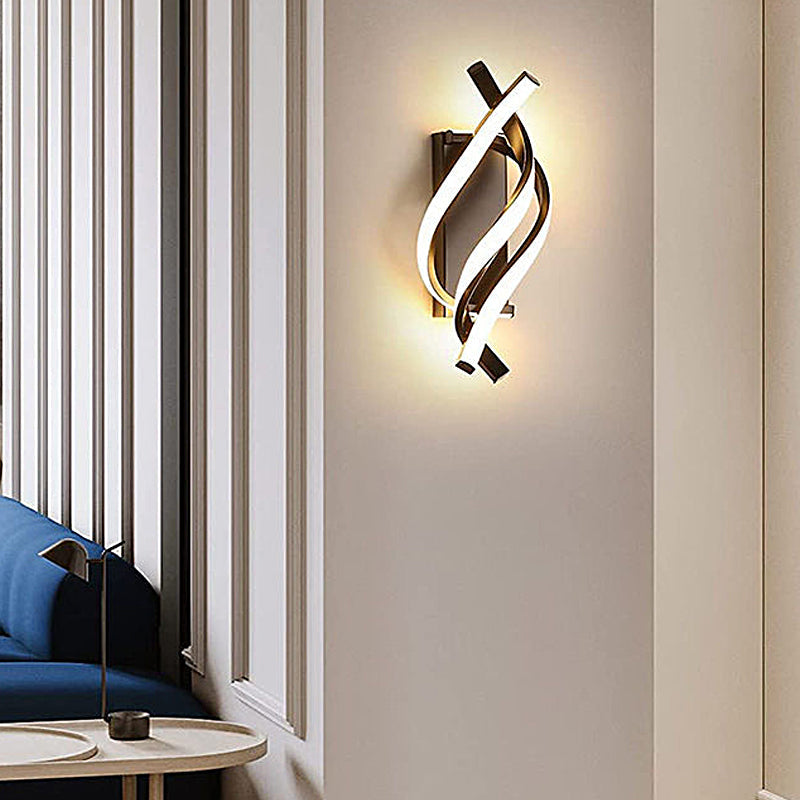 Spiral wall sconce enhancing a contemporary bedroom with sleek, artistic design.