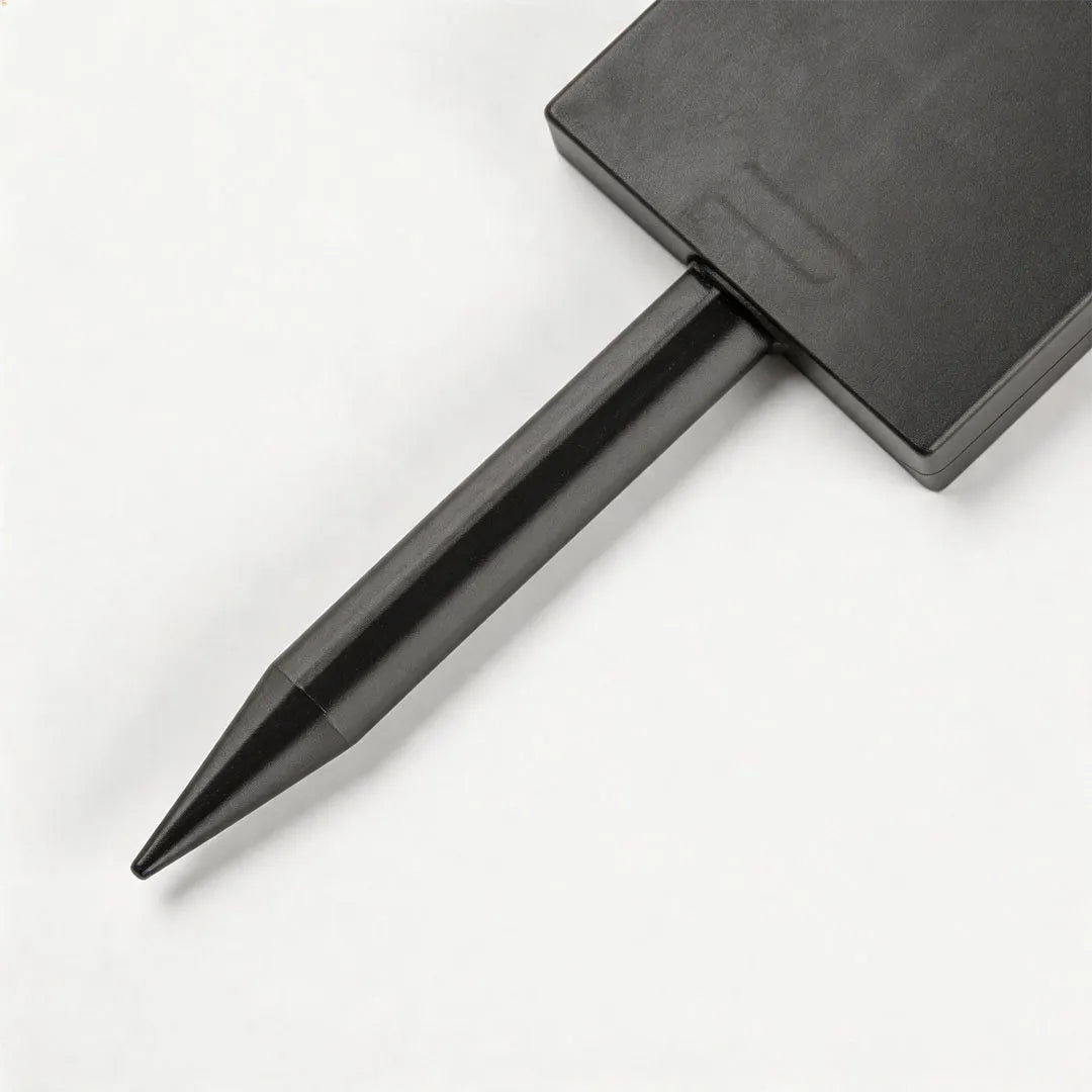 Close-up of spotlight ceiling light showing the brushed metal cylinder and adjustable mounting bracket.