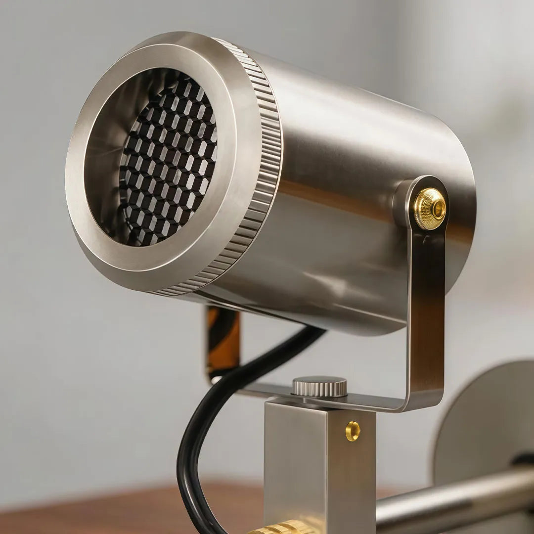 Close-up of spotlight ceiling light showing the textured reflector and cylindrical metal housing.
