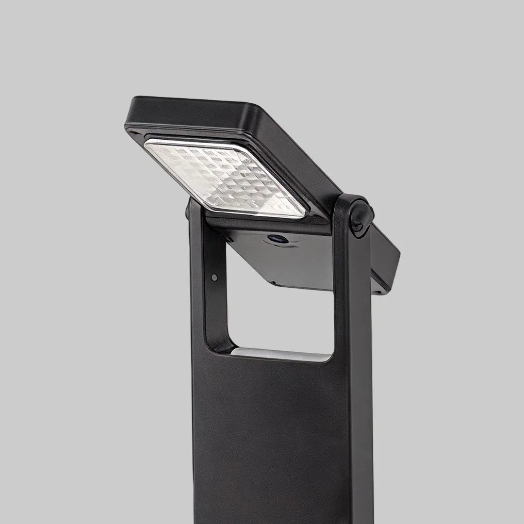 Close-up of spotlight ceiling light showing the textured reflector and cylindrical metal housing.