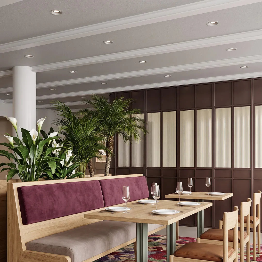Spotlight ceiling lights installed above a restaurant seating area with balanced recessed lighting.