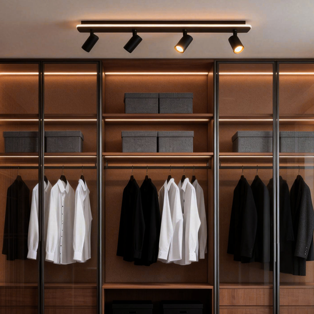 Spotlight Fixture installed above a modern wardrobe, providing focused ceiling lighting to highlight clothing and shelving details.