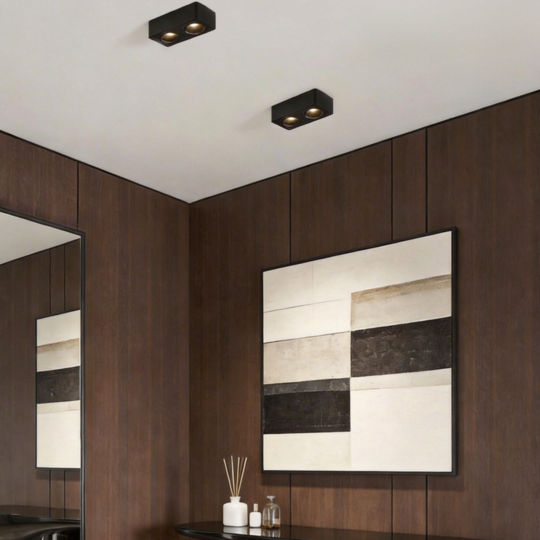 Spotlight LED square with a minimalist design, enhancing a contemporary living room.