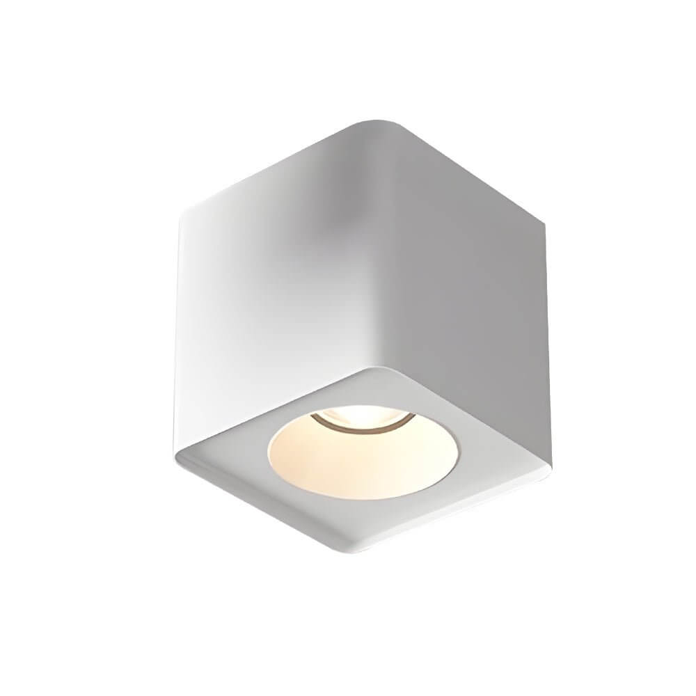 Spotlight LED square with a sleek design, illuminating a cozy living room.