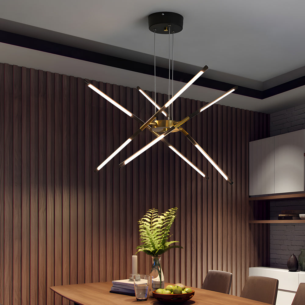 Sputnik chandelier in a black and gold finish illuminating a moody dining room with dark wood panel walls and a dramatic ceiling design.